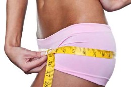 woman measuring hips